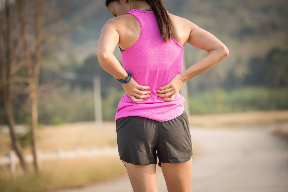 A lady with lower back pain when running