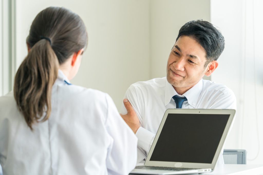 calcification of shoulder tendon treatment Doctor consulting patient about treatments for calcification of their shoulder tendon