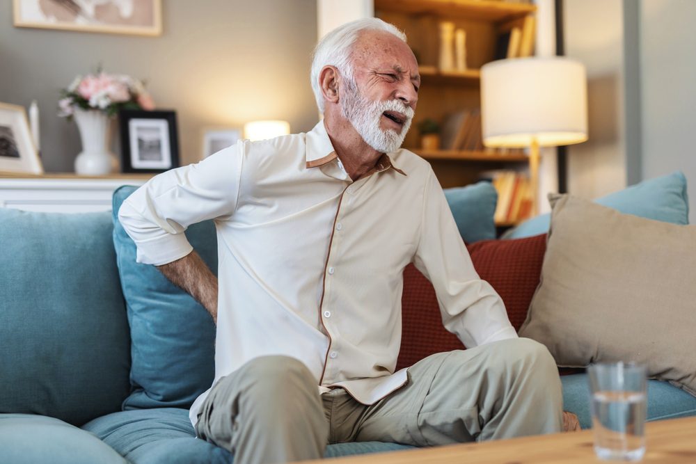Elderly man with lower back pain 