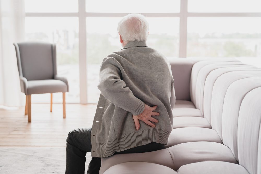 Elderly man suffering from a Herniated lumbar disc