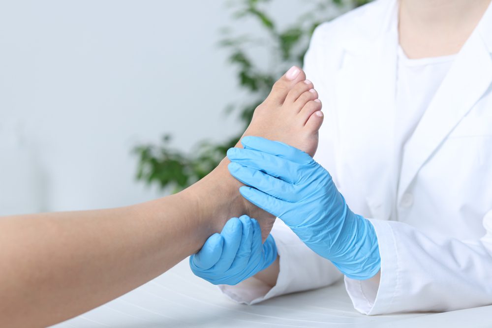 Ankle Pain healing. Physical physician helping someone deal with Ankle Pain.