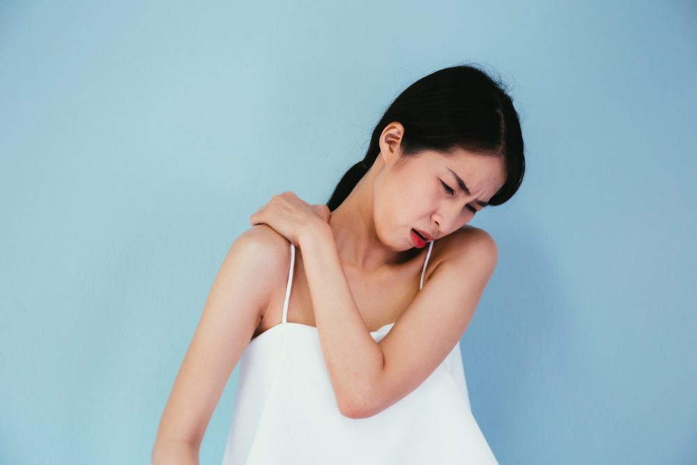 Rhomboid Muscle Pain Woman suffering from Rhomboid Muscle Pain.