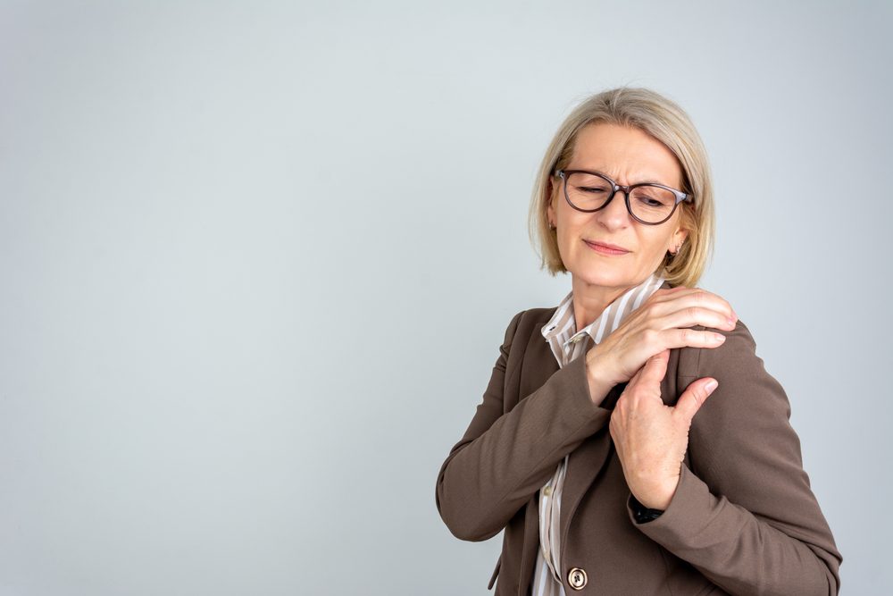 Shoulder Arthritis pain. Woman suffering from Shoulder Arthritis.