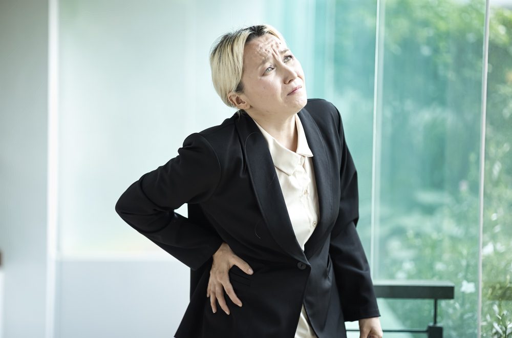 Sore back and pelvis Woman suffering Sore back and pelvis.