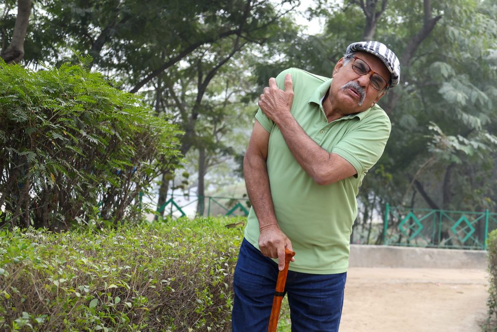 Stem cells for pain. Elderly man suffering from pain in his shoulder.
