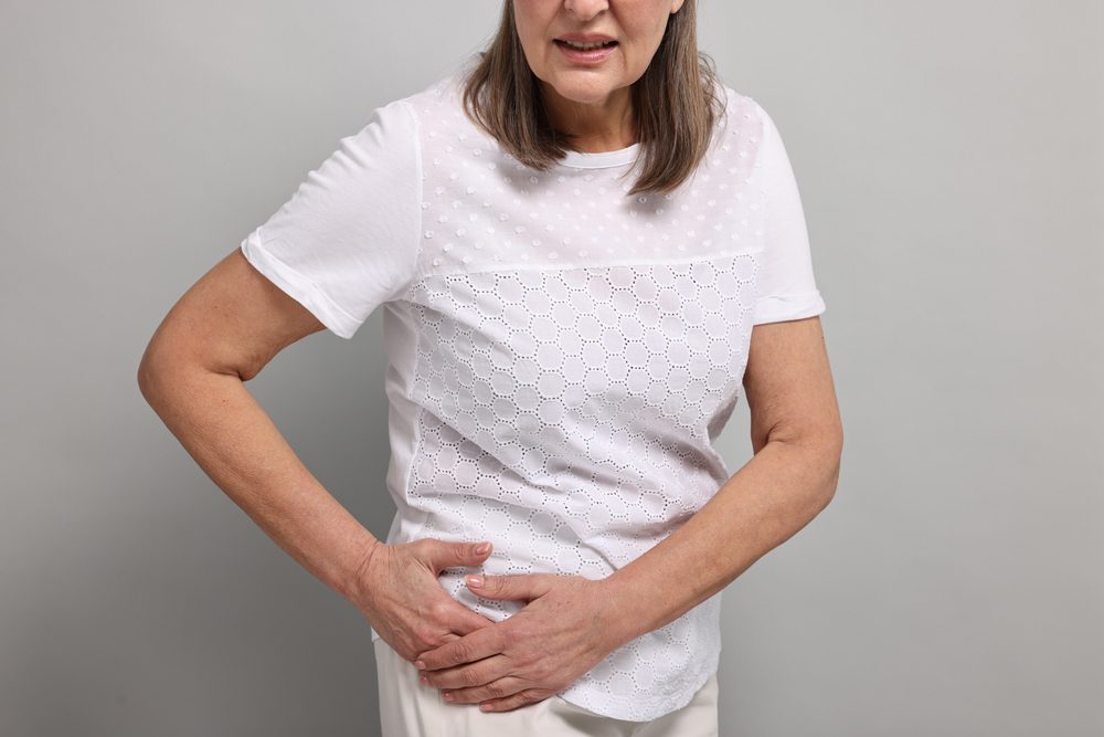 steroids for hip pain. Elderly woman suffering from pain in the hip.