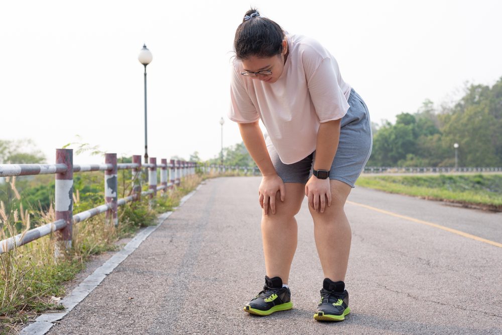 Knee weakness Woman getting weak in the knees while exercising.