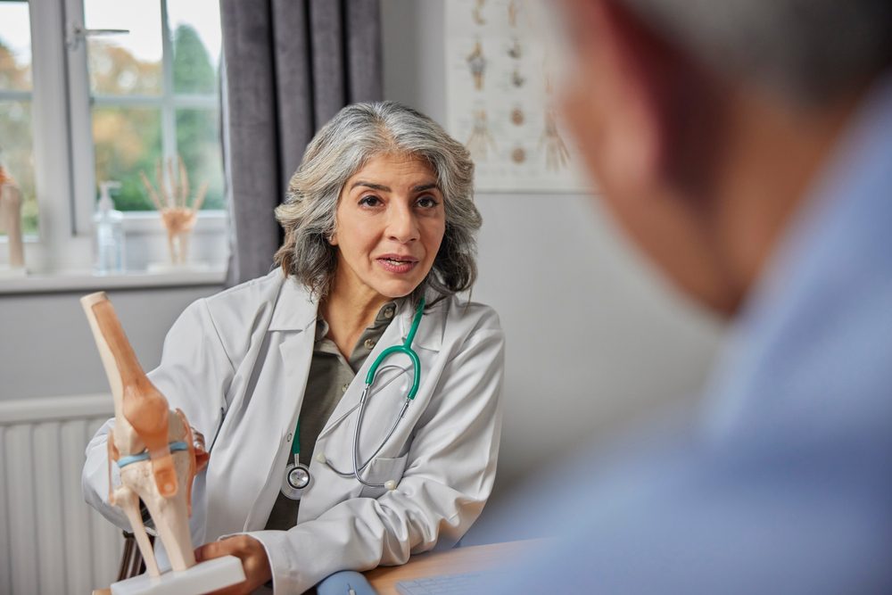 A doctor explaining hypermobility